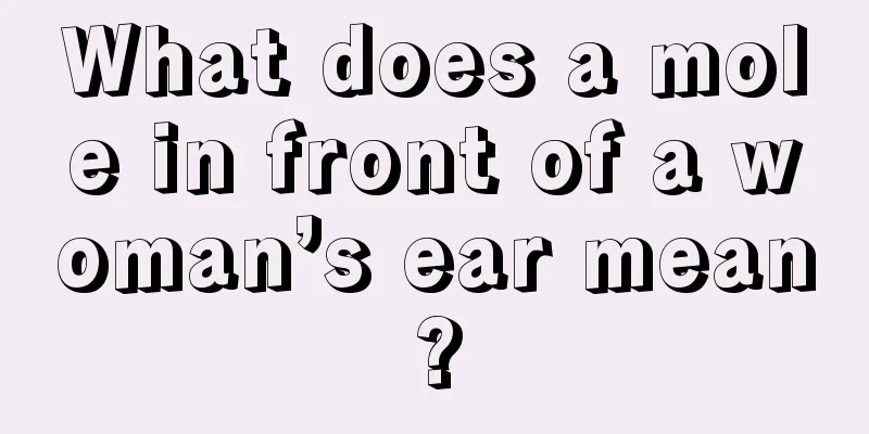 What does a mole in front of a woman’s ear mean?