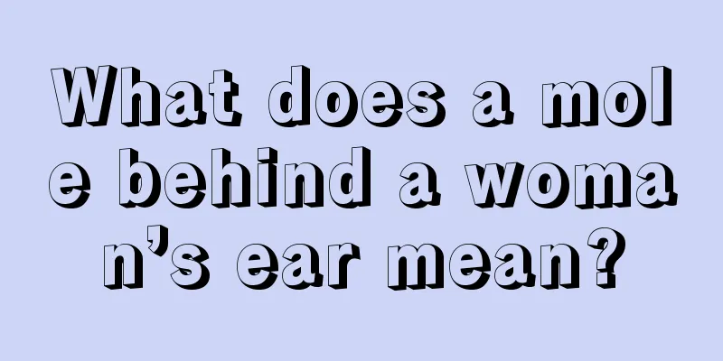 What does a mole behind a woman’s ear mean?