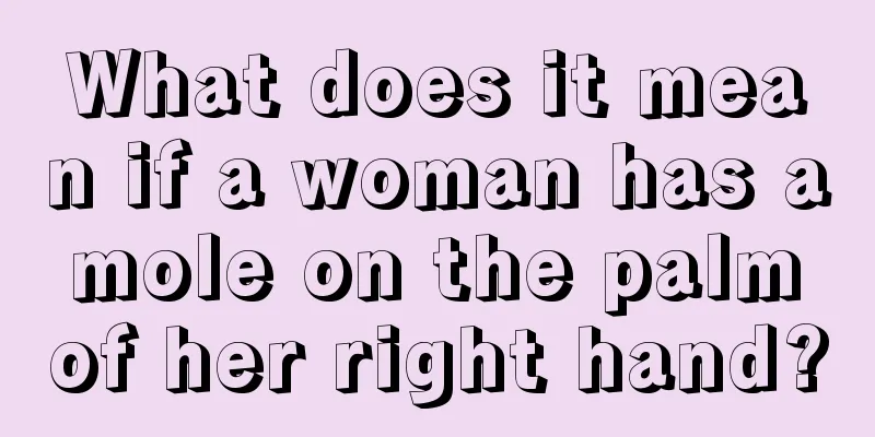 What does it mean if a woman has a mole on the palm of her right hand?