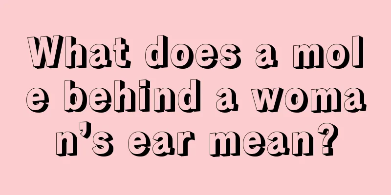 What does a mole behind a woman’s ear mean?