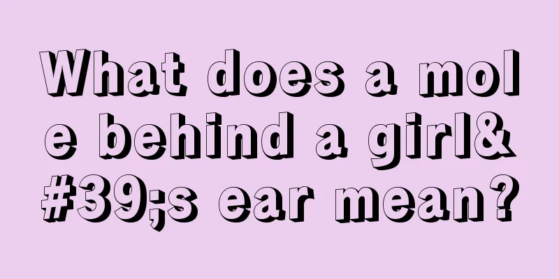 What does a mole behind a girl's ear mean?