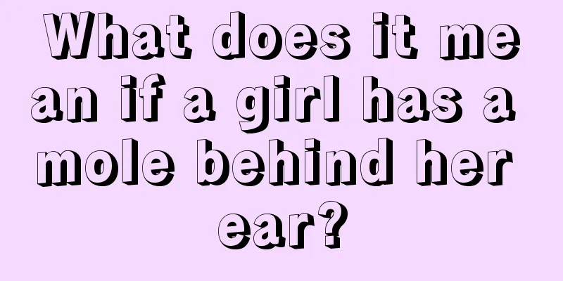 What does it mean if a girl has a mole behind her ear?