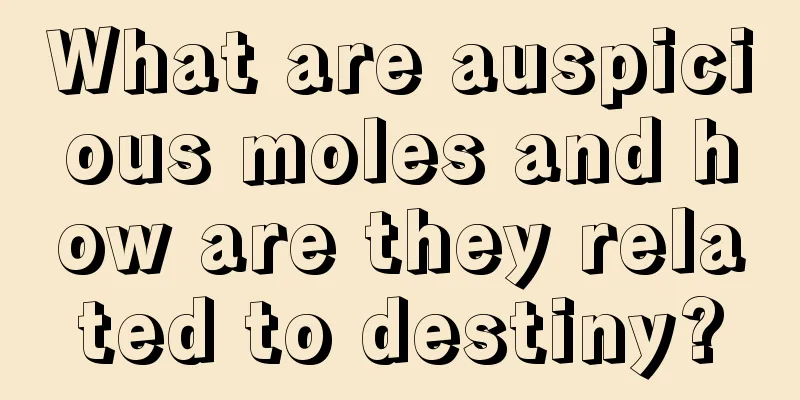 What are auspicious moles and how are they related to destiny?