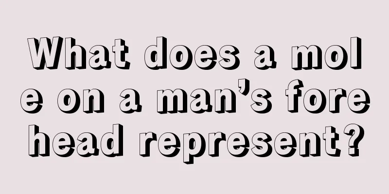 What does a mole on a man’s forehead represent?