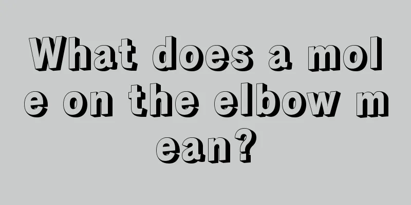 What does a mole on the elbow mean?