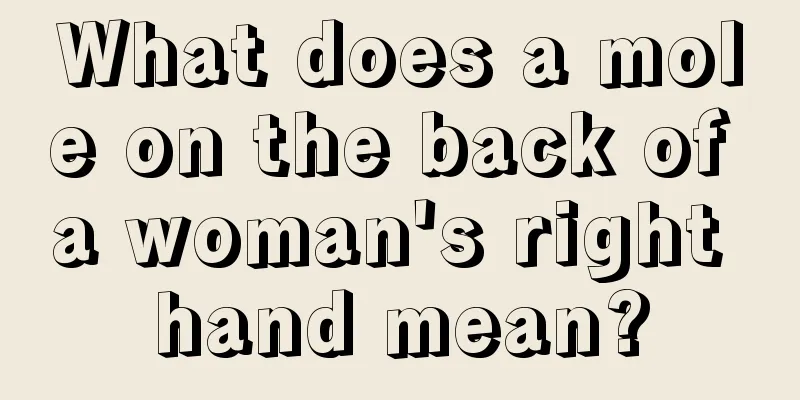What does a mole on the back of a woman's right hand mean?