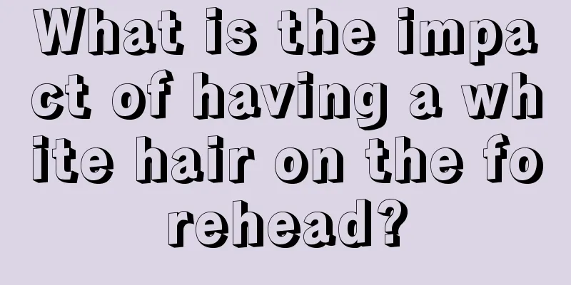 What is the impact of having a white hair on the forehead?