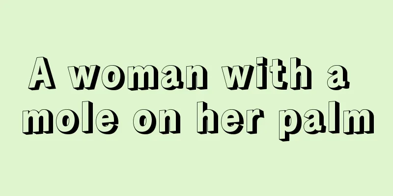 A woman with a mole on her palm