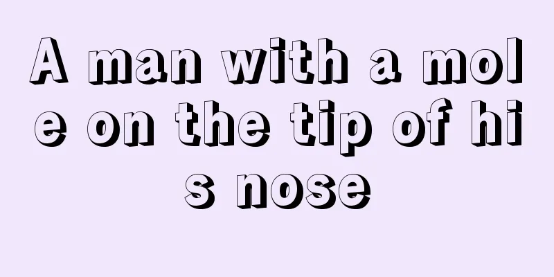 A man with a mole on the tip of his nose