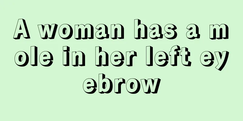 A woman has a mole in her left eyebrow