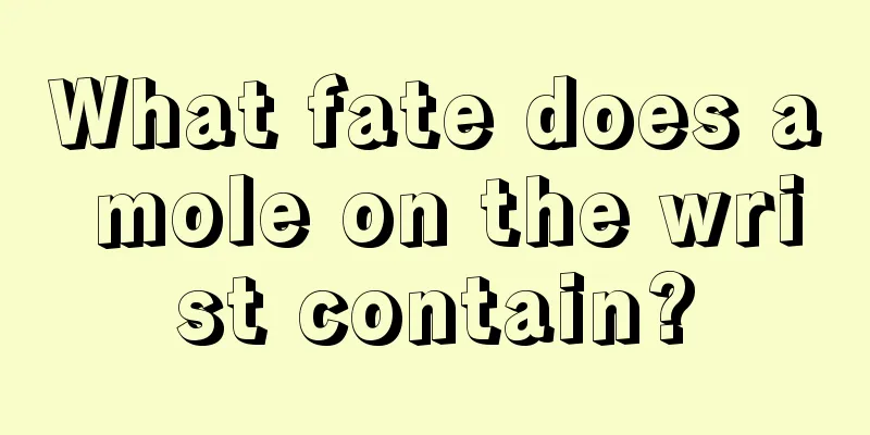 What fate does a mole on the wrist contain?