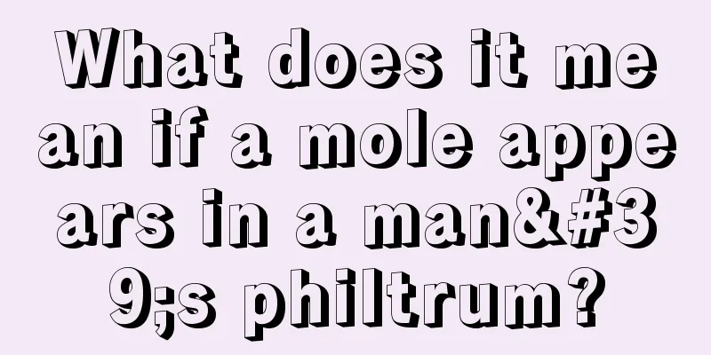 What does it mean if a mole appears in a man's philtrum?