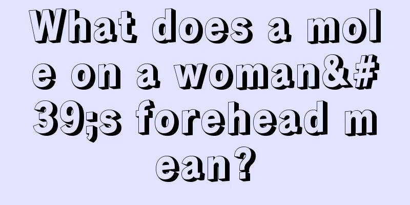 What does a mole on a woman's forehead mean?