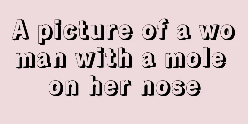 A picture of a woman with a mole on her nose