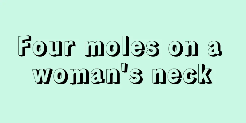 Four moles on a woman's neck