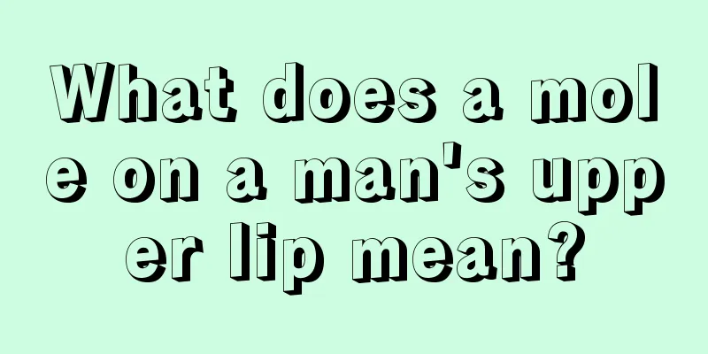 What does a mole on a man's upper lip mean?