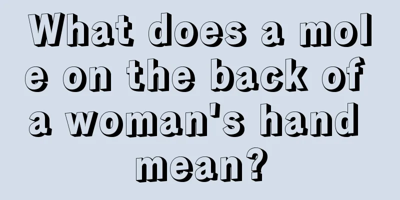 What does a mole on the back of a woman's hand mean?