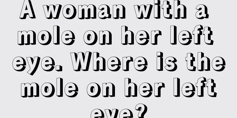 A woman with a mole on her left eye. Where is the mole on her left eye?