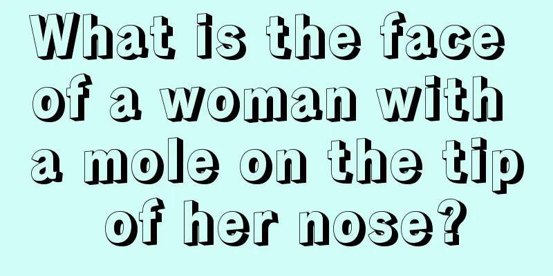 What is the face of a woman with a mole on the tip of her nose?
