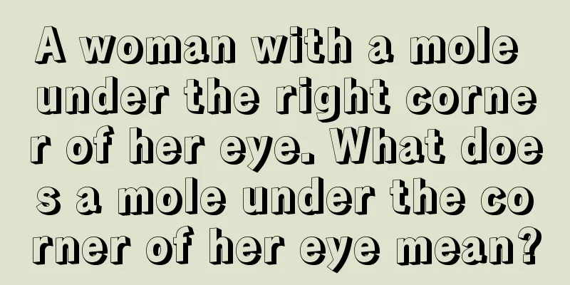 A woman with a mole under the right corner of her eye. What does a mole under the corner of her eye mean?