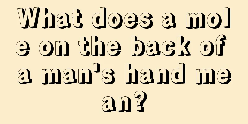 What does a mole on the back of a man's hand mean?
