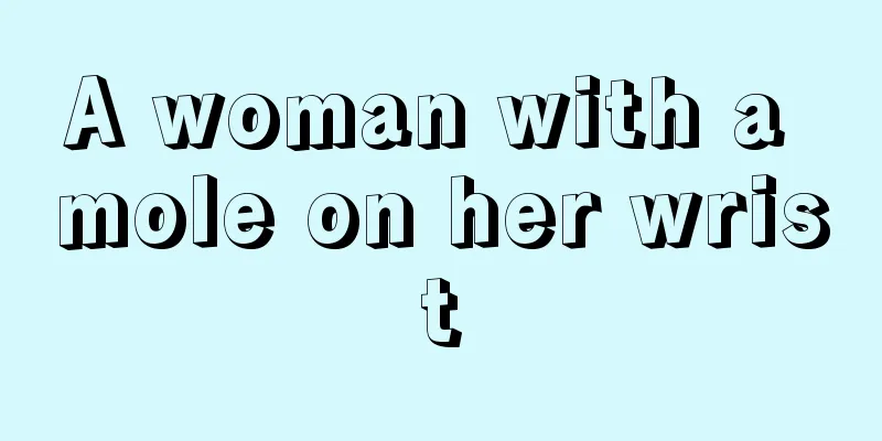 A woman with a mole on her wrist