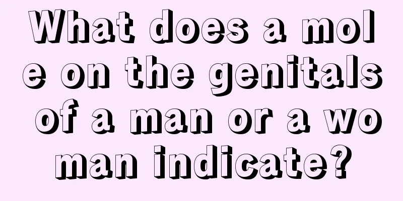 What does a mole on the genitals of a man or a woman indicate?