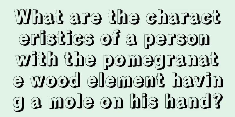 What are the characteristics of a person with the pomegranate wood element having a mole on his hand?
