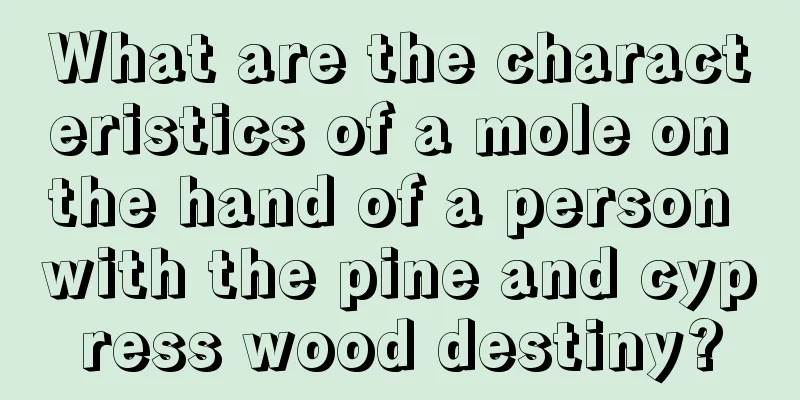What are the characteristics of a mole on the hand of a person with the pine and cypress wood destiny?