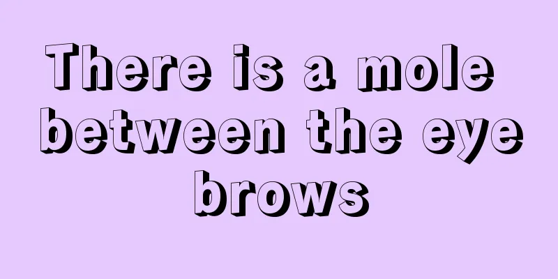 There is a mole between the eyebrows