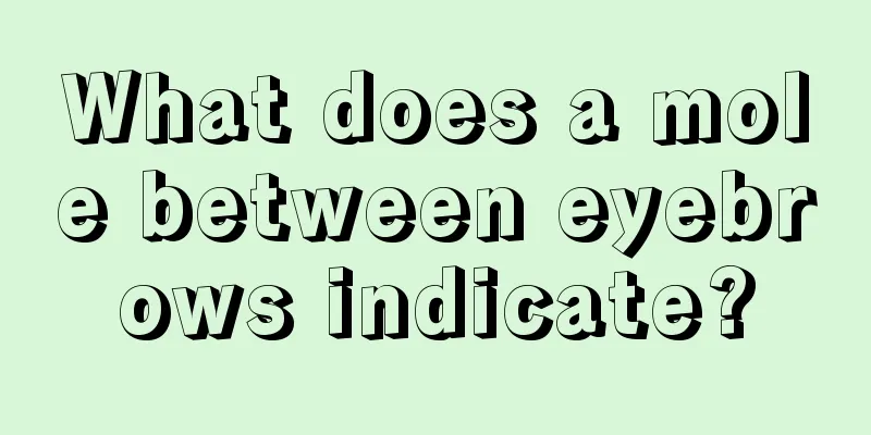 What does a mole between eyebrows indicate?