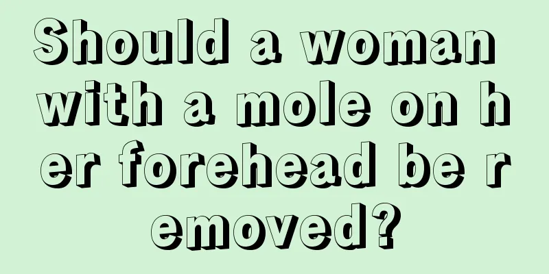 Should a woman with a mole on her forehead be removed?
