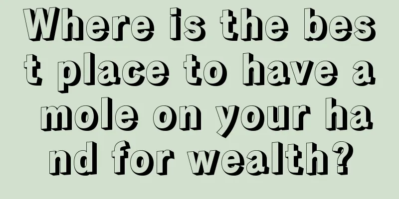Where is the best place to have a mole on your hand for wealth?