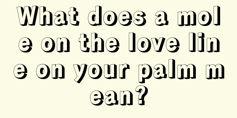 What does a mole on the love line on your palm mean?
