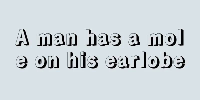 A man has a mole on his earlobe