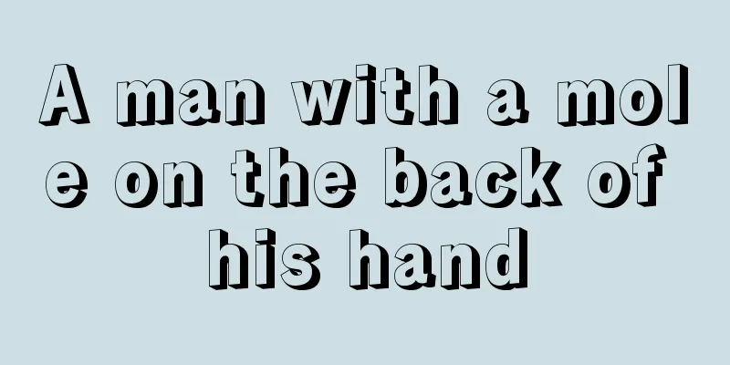 A man with a mole on the back of his hand