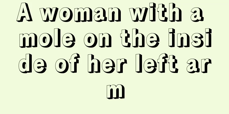 A woman with a mole on the inside of her left arm