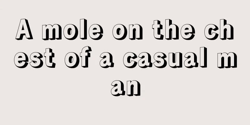 A mole on the chest of a casual man