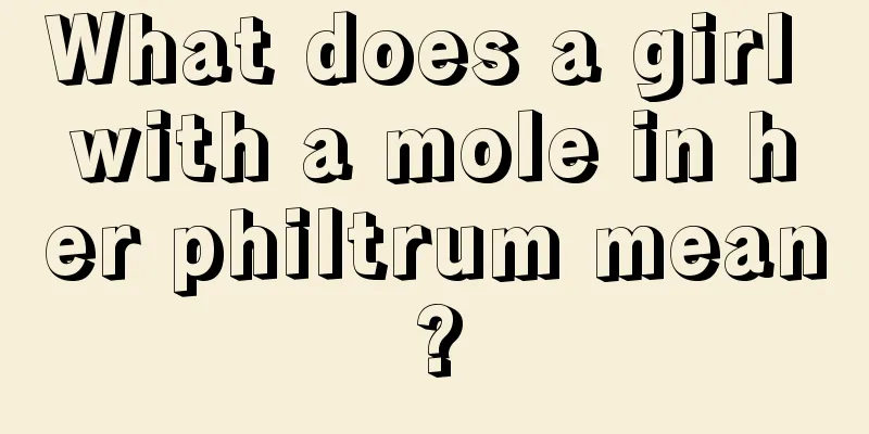 What does a girl with a mole in her philtrum mean?