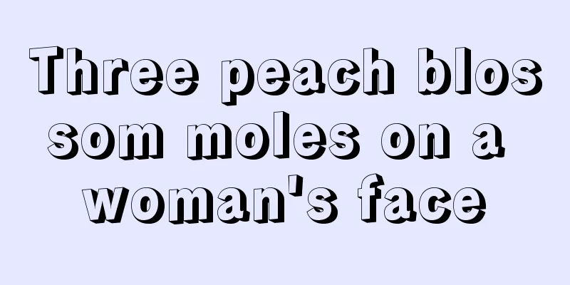 Three peach blossom moles on a woman's face