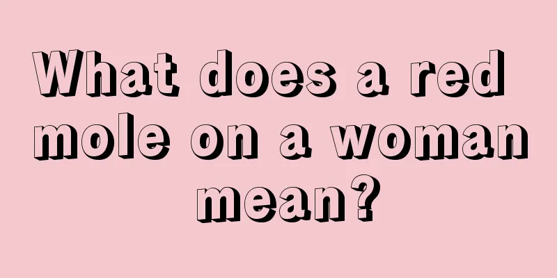 What does a red mole on a woman mean?
