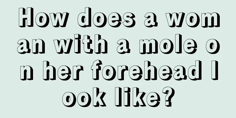 How does a woman with a mole on her forehead look like?