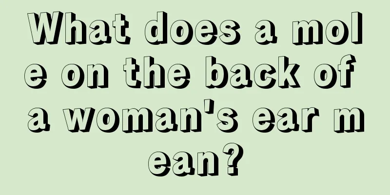 What does a mole on the back of a woman's ear mean?