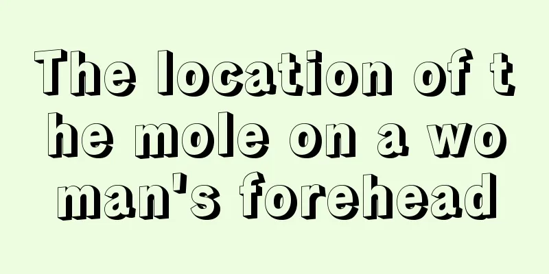 The location of the mole on a woman's forehead