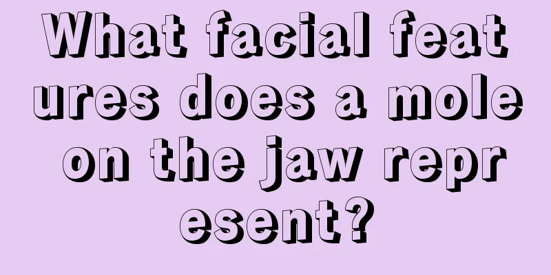 What facial features does a mole on the jaw represent?