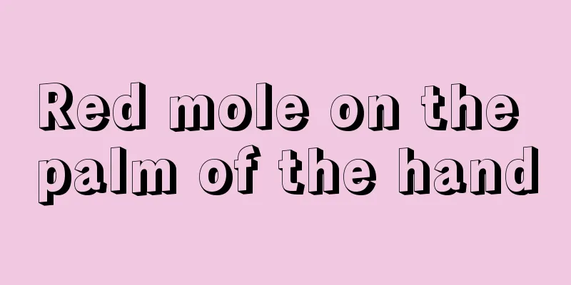 Red mole on the palm of the hand