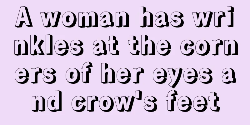 A woman has wrinkles at the corners of her eyes and crow's feet
