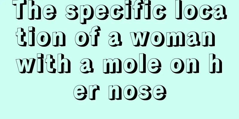 The specific location of a woman with a mole on her nose