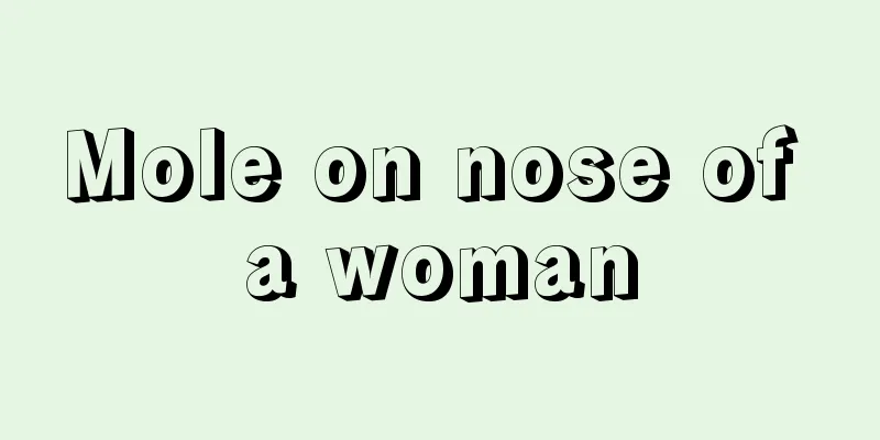 Mole on nose of a woman