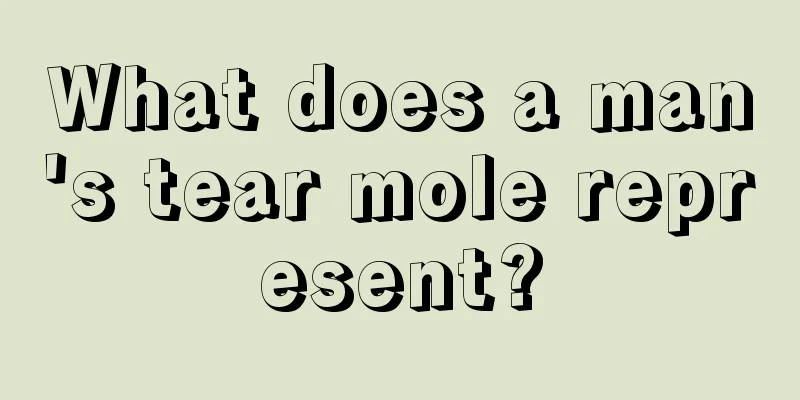 What does a man's tear mole represent?